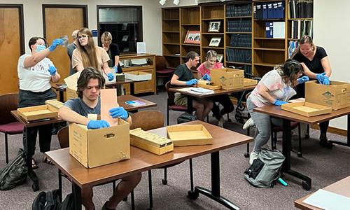 Students sort through archive materials